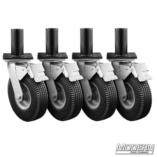 Set of four caster wheels with black tires and metal brackets on a white background, branded 'Modern Studio Equipment'.